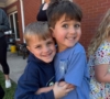 Children hugging outside at Crestwood