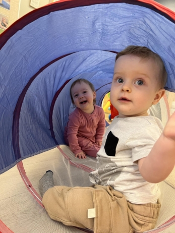 Infants playing in tunnel at Crestwood