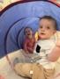 Infants playing in tunnel at Crestwood