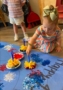 Child painting using unique sponge at Crestwood