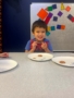 child smiling with snacks at crestwood