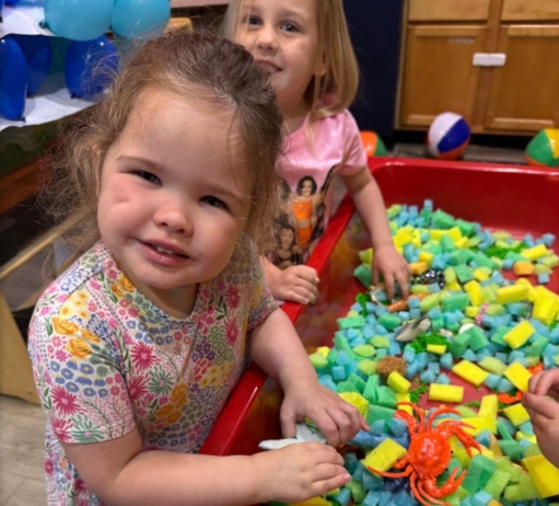 Children playing in toybin together at Crestwood
