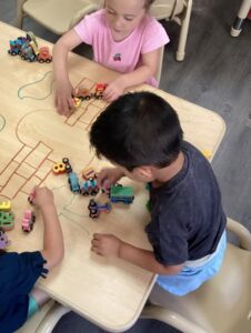 young boy playing with toys in classroom at cadence academy preschool and daycare in dupont washington