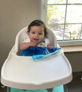 infant in highchair ready to eat snacks at cadence academy preschool and daycare in dupont washinton