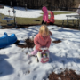 Child playing in the snow on playground at Creative Kids Childcare Centers Beekman