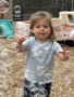 Child playing with bubbles outside on playground at Creative Kids Childcare Centers Beekman