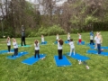 Children doing yoga outside at Creative Kids Childcare Centers Beekman