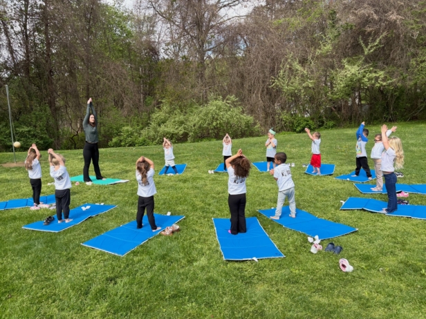 Children doing yoga outside at Creative Kids Childcare Centers Beekman