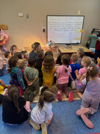 Children sitting on carpet learning at Creative Kids Childcare Centers Beekman