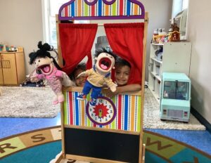 Children putting on a puppet show at Creative Kids Childcare Centers Beekman
