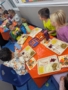 Children eating thanksgiving food together at Creative Kids Childcare Centers Beekman