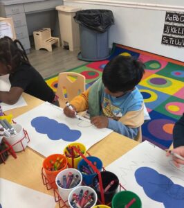 child doing hands on activity at cadence academy preschool and daycare branch hollow carrollton texas