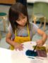Child doing crafts indoors