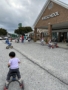 children riding bikes outside of cadence academy preschool and daycare northeast