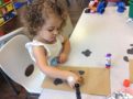Child doing crafts indoors
