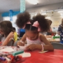 child doing hands on activity in class