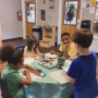 children sitting at desk completing a hands on activity together at cadence academy preschool and daycare mauldin