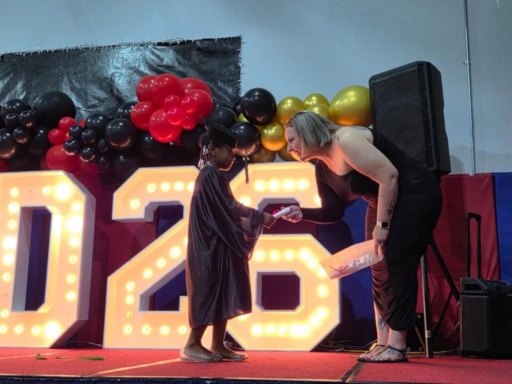 Child graduating preschool at cadence academy preschool and daycare branch hollow