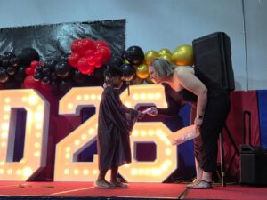 Child graduating preschool at cadence academy preschool and daycare branch hollow