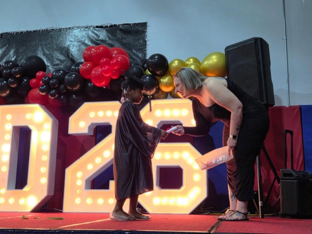 Child graduating preschool at cadence academy preschool and daycare branch hollow