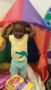A child playing in a fort indoors