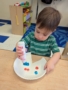 male child making arts and crafts at cadence academy chandler heights