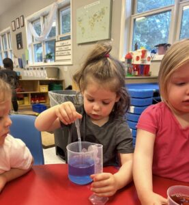 child doing science learning at cadence academy preschool and daycare raintree in charlotte, north carolina