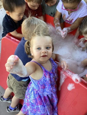 female child playing outside at cadence academy chandler heights