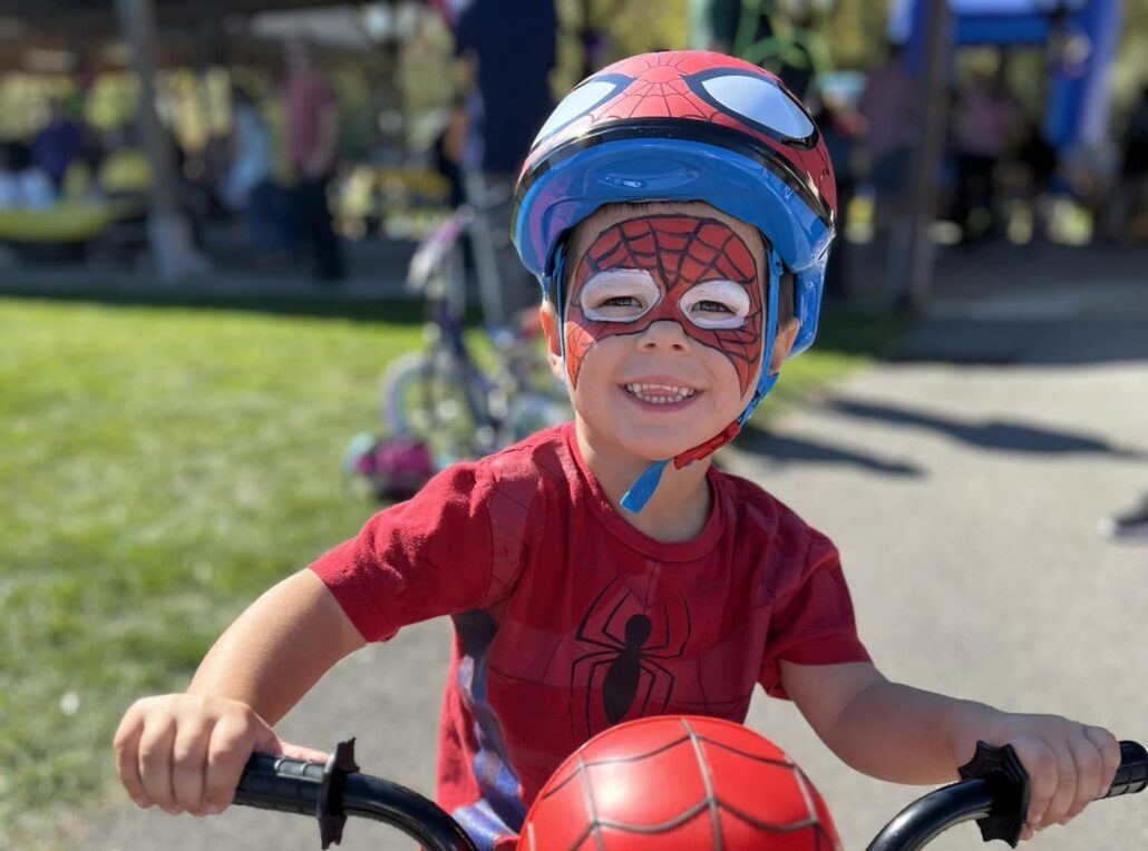 child riding bike outside at at creative kids childcare center kent new york