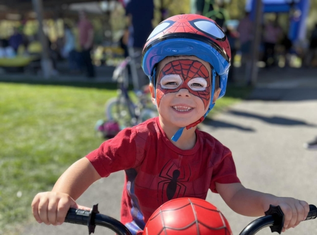 child riding bike outside at at creative kids childcare center kent new york
