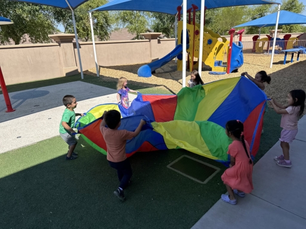 multiple male and female children playing outside and having fun at cadence academy chandler heights