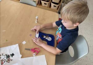 Male child making holiday craft at Phoenix Children's Academy Private Preschool Surprise 226