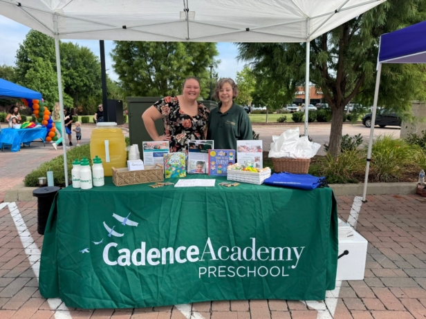 adults standing at cadence table at preschool and daycare cadence academy preschool nolensville 504