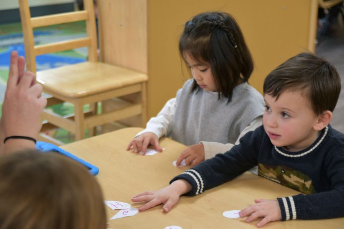 cadence_education_local_photos_campaign_934_main_st_east_greenwich_ri_02818_usa_group_of_children_playingreading-02-09-2024-17077824351300.6789262275194357