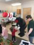 cat_in_the_hat_holding_hands_withpreschool_girl_cadence_academy_preschool_crestwood_ky-338x450