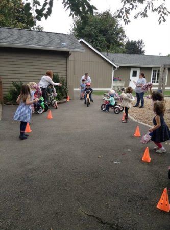 cheering_at_the_st_jude_trike-a-thon_cadence_academy_preschool_yelm_2_olympia_wa-333x450