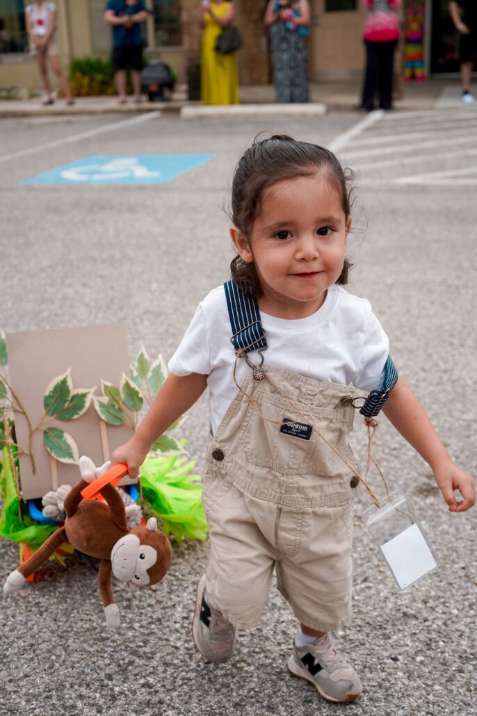 child at parade at preschool and daycare of 339 wild horse