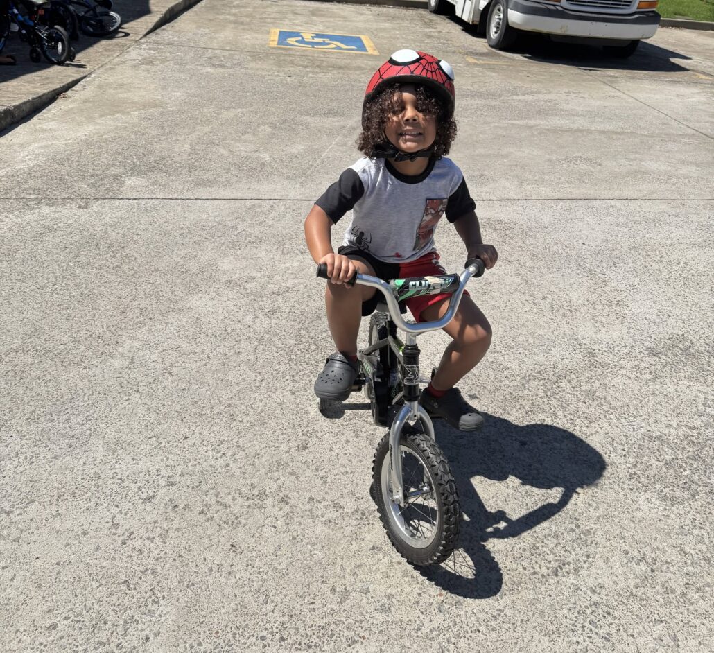 child biking outside at preschool and daycare cadence academy preschool nolensville 504
