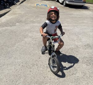 child biking outside at preschool and daycare cadence academy preschool nolensville 504