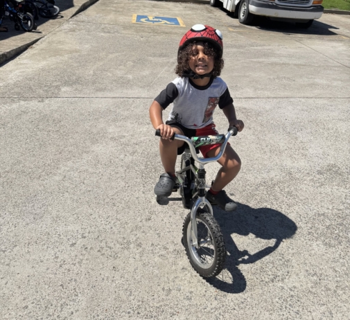 child biking outside at preschool and daycare cadence academy preschool nolensville 504
