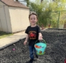 child collecting easter eggs outside on playground at preschool and daycare cadence academy preschool 502 spring hill