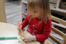 child coloring at table at Cadence Academy Preschool and Daycare Yelm Highway in Olympia, Washington