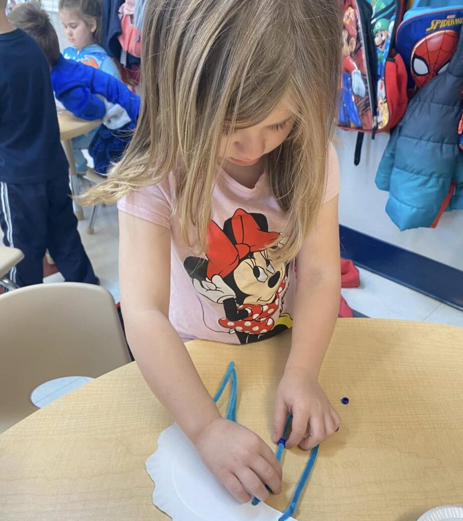 child doing art