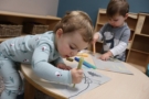 child drawing inside at Cadence Academy Preschool and Daycare Yelm Highway in Olympia, Washington