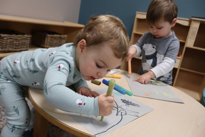 child drawing inside at Cadence Academy Preschool and Daycare Yelm Highway in Olympia, Washington