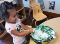 child engaging in hands on activity playing at cadence academy wylie texas