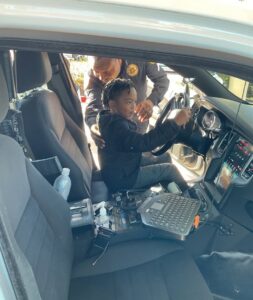 child in police car at 503 cordova