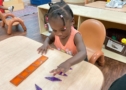 Child learning with hands on activity at Cadence Academy Preschool Olive Branch, Mississippi