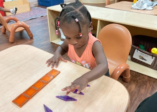 Child learning with hands on activity at Cadence Academy Preschool Olive Branch, Mississippi