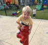 Child smiling climbing outside at Cadence academy preschool and daycare 505 murfreesboro